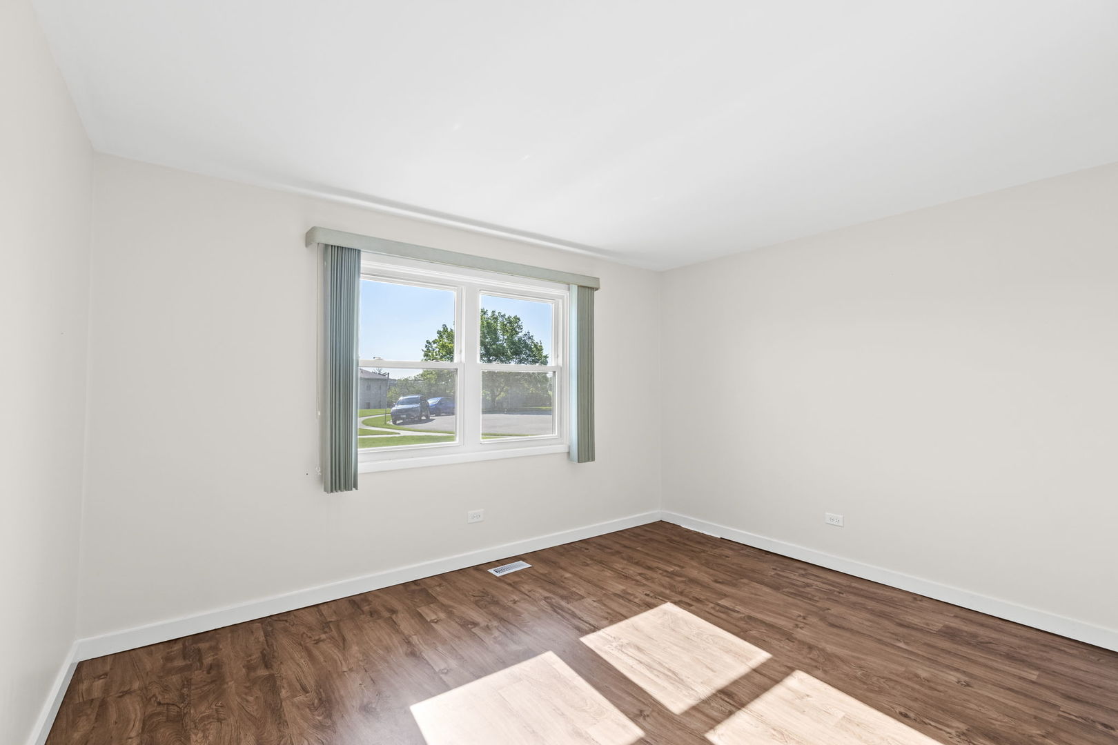 5880 Rembrandt Court, Unit C Hanover Park, IL 60133 - Photo 12 of 22 an empty room with a window