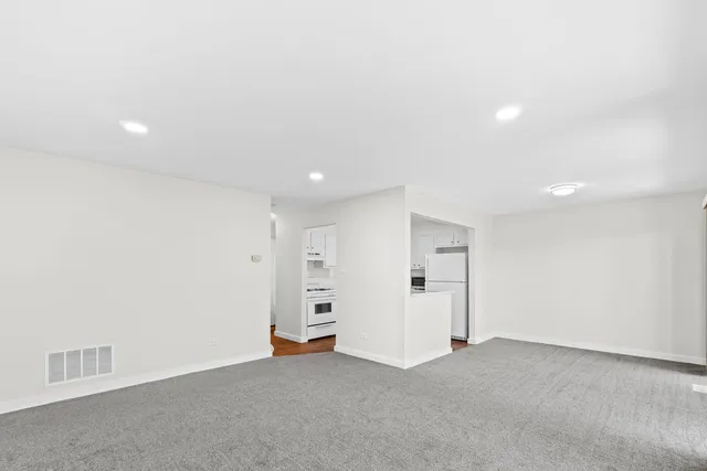 an empty room with a ceiling fan