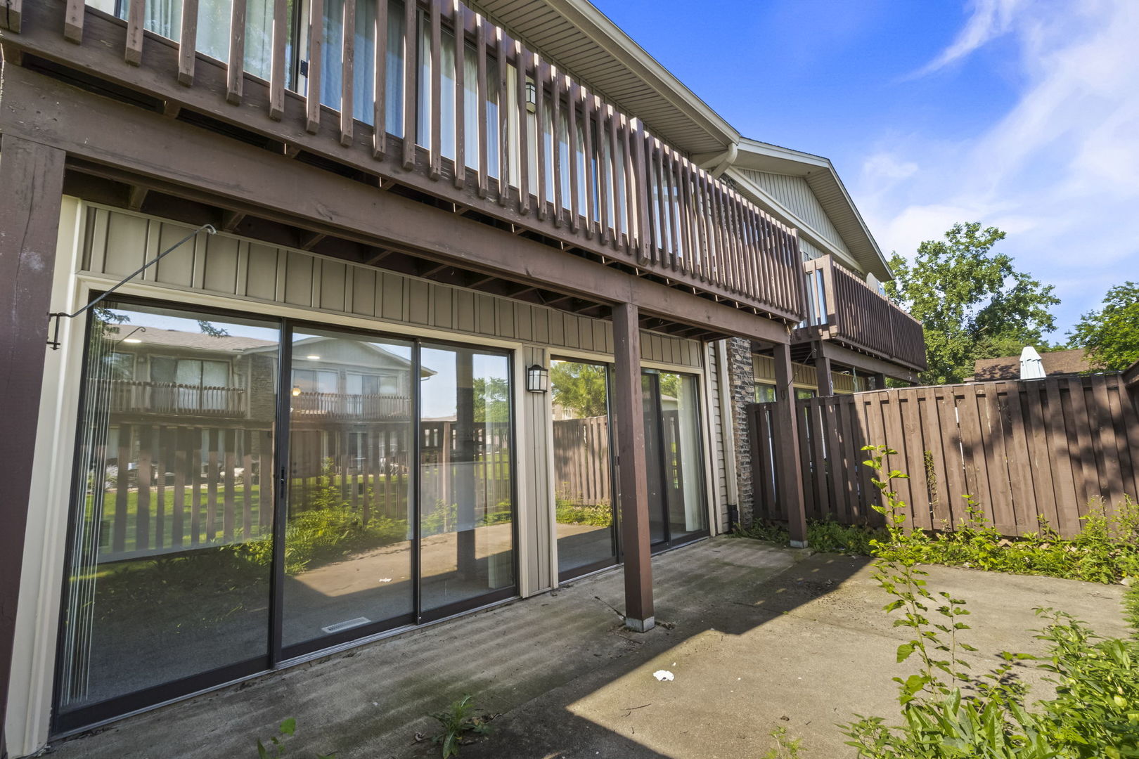5880 Rembrandt Court, Unit C Hanover Park, IL 60133 - Photo 4 of 22 a front view of a house with a garden