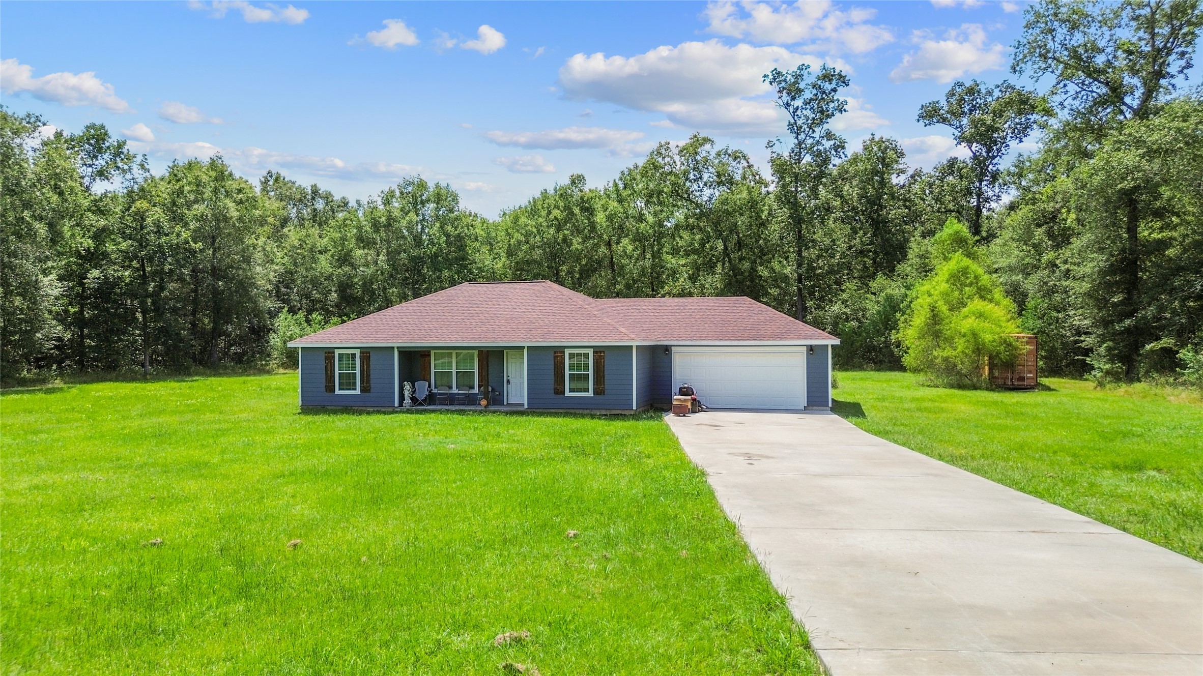 a front view of a house with yard