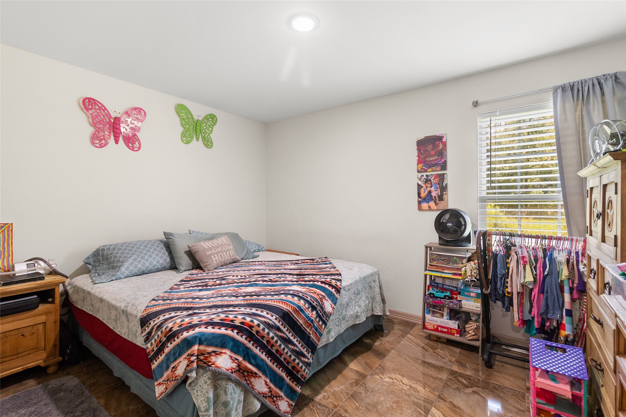 1545 County Road 2145 Cleveland, TX 77327 - Photo 17 of 22 a bedroom with a bed and a window