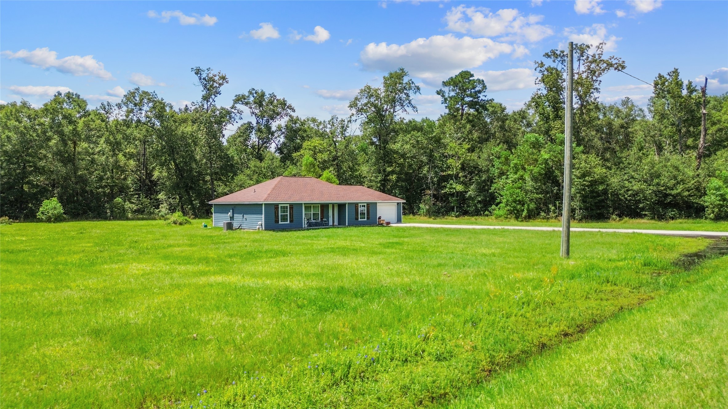 1545 County Road 2145 Cleveland, TX 77327 - Photo 2 of 22 a view of a garden