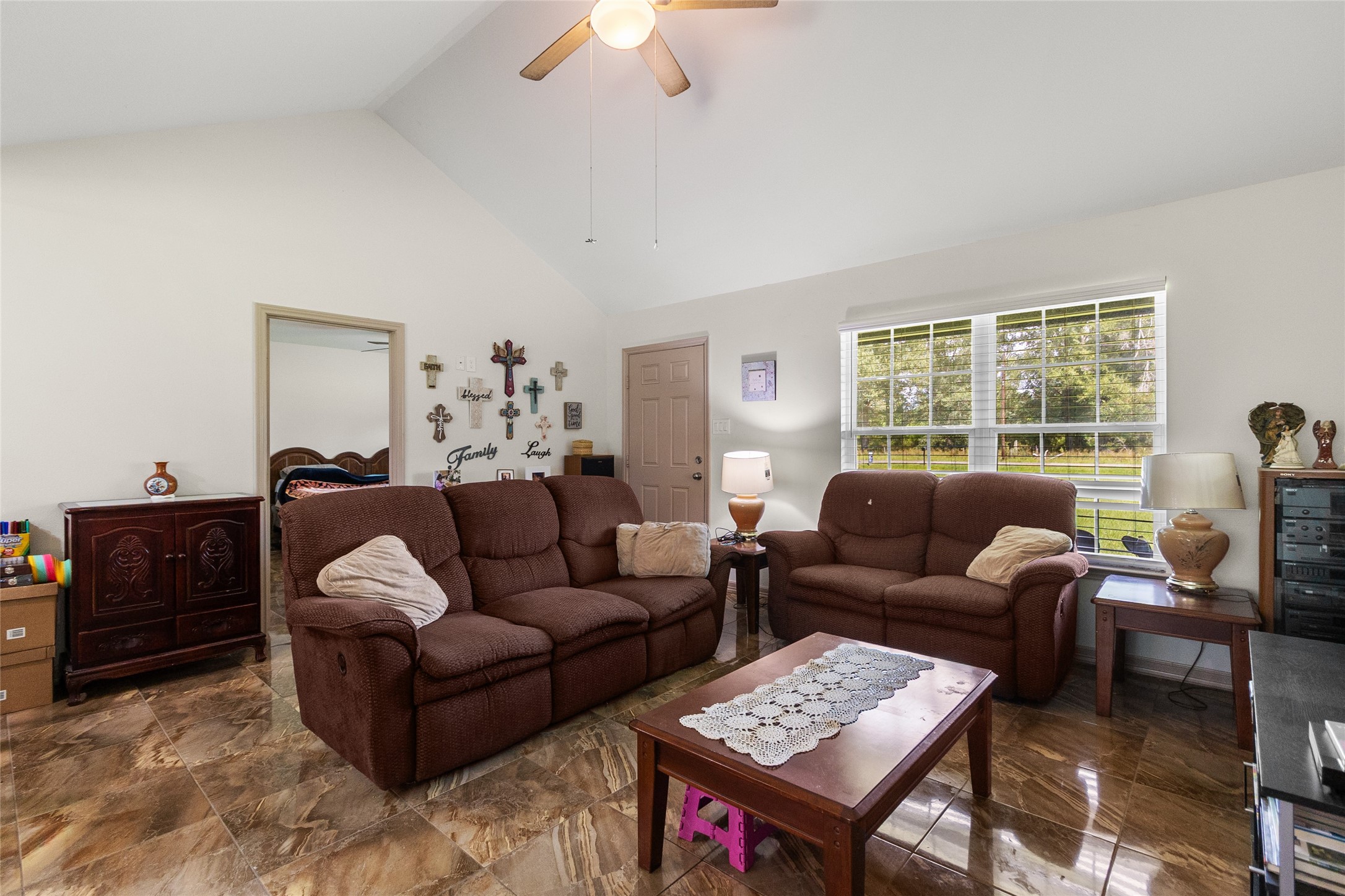 1545 County Road 2145 Cleveland, TX 77327 - Photo 4 of 22 a living room with furniture and a window