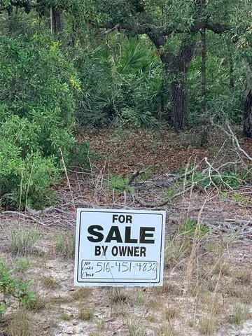 a sign broad on the side of the road