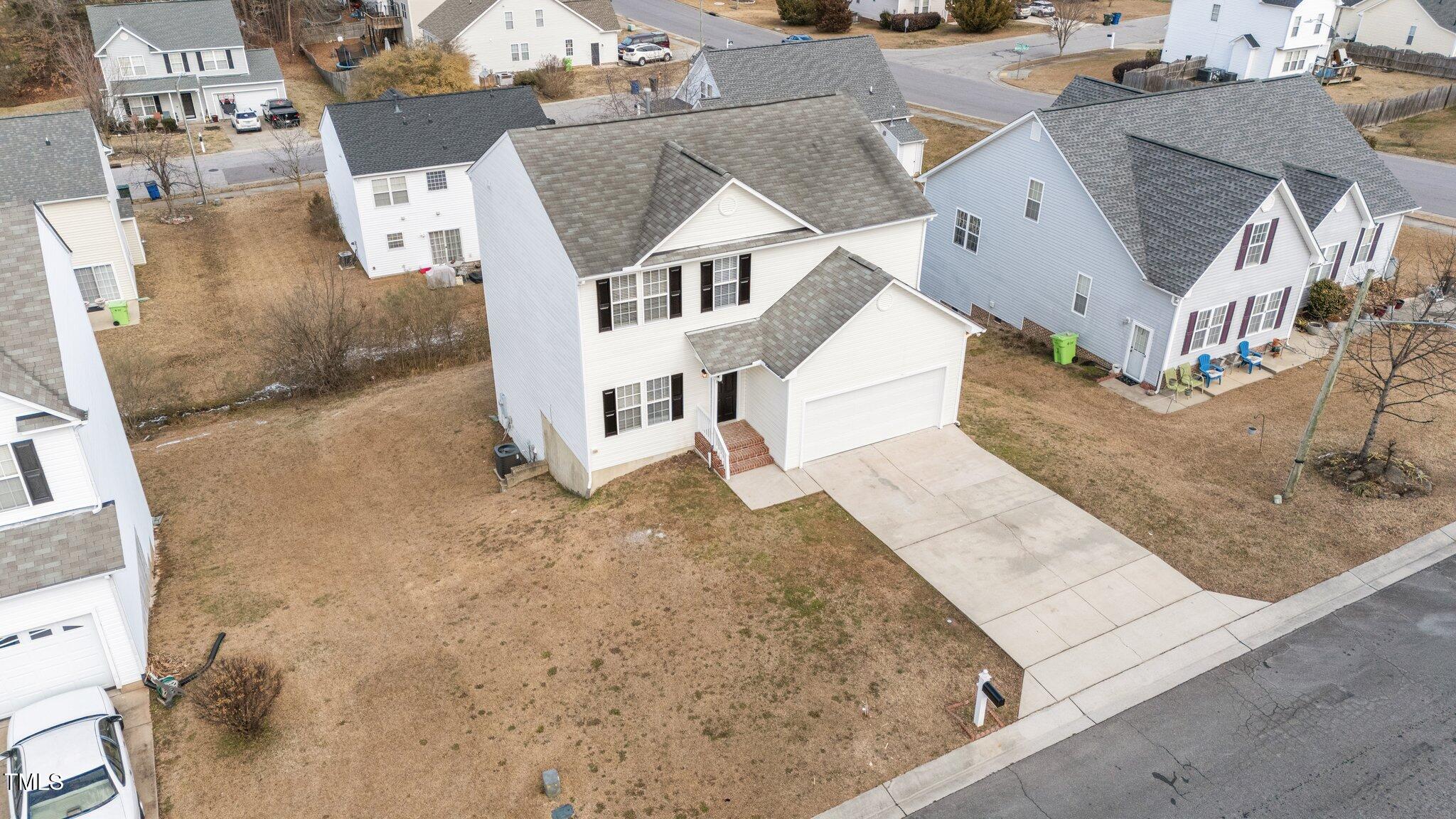 7041 Spanglers Spring Way Raleigh, NC 27610 - Photo 4 of 44 4-web-or-mls-DJI_20250124123056_0983_D
