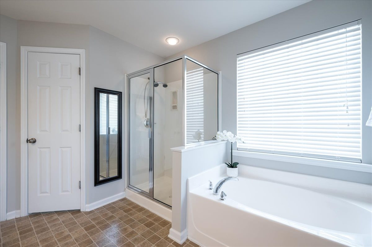 7810 San Gabriel Street Raleigh, NC 27613 - Photo 21 of 29 Large master bathroom with dual vanities, separate tub and shower, and huge walk-in closet Master Bathroom