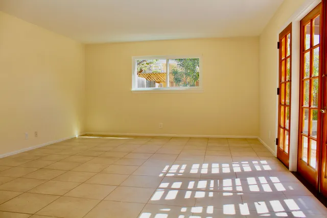 a view of an empty room and a window