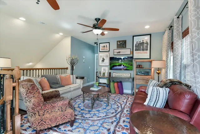 a living room with furniture and a rug