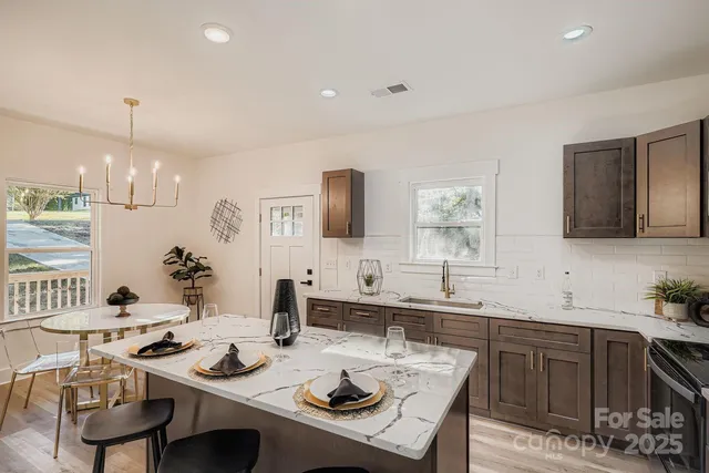 a kitchen with a sink stove and cabinets