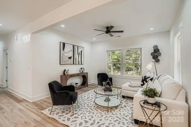 a living room with furniture and a large window