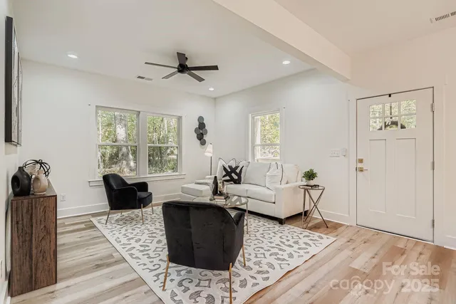 a living room with furniture and a large window