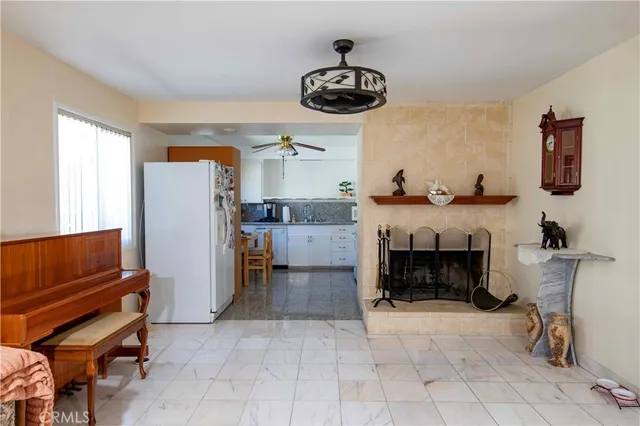 a kitchen with furniture and a fireplace