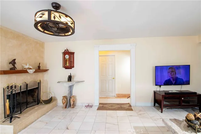 a kitchen with a stove a sink a refrigerator and a window