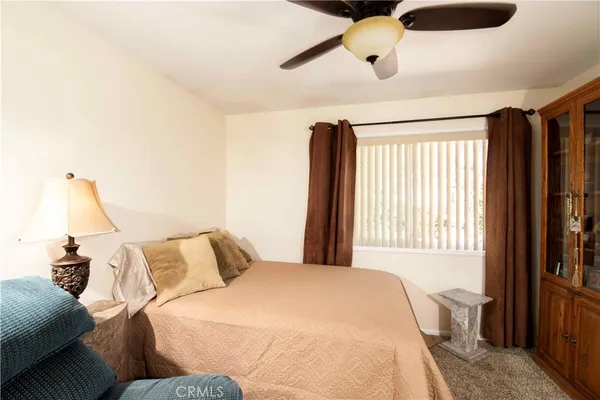 a living room with furniture and a lamp
