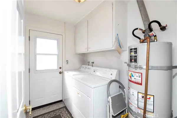 a bathroom with a sink vanity mirror and toilet