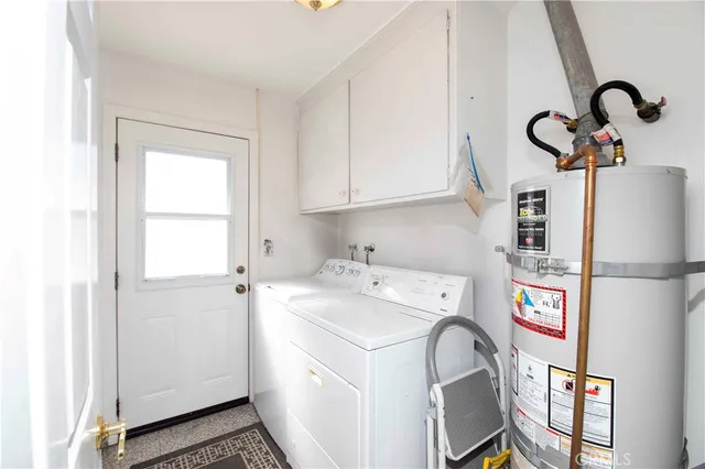 a bathroom with a sink vanity mirror and toilet