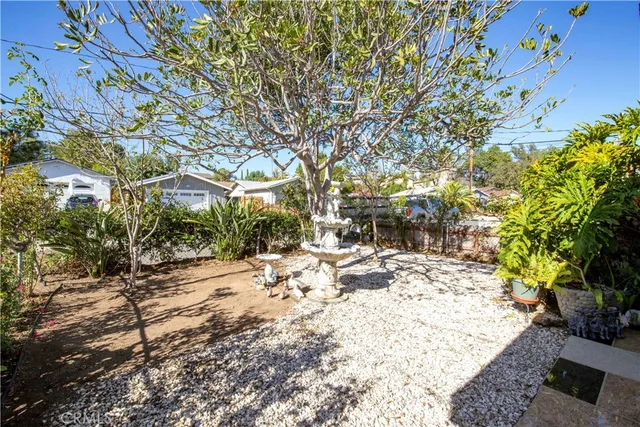 a view of a backyard of the house