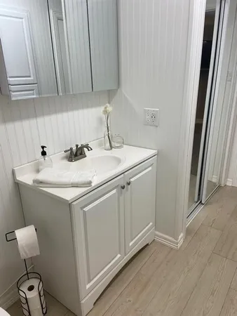 a utility room with sink dryer and washer