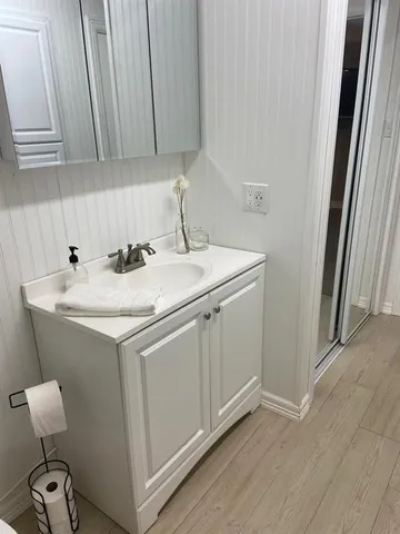 a utility room with sink dryer and washer