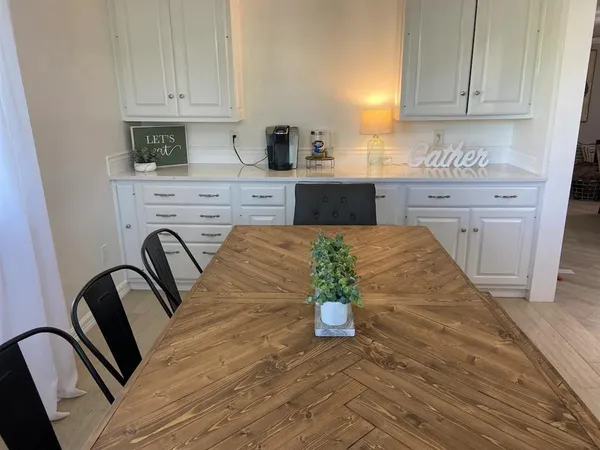 a kitchen with sink refrigerator and stove
