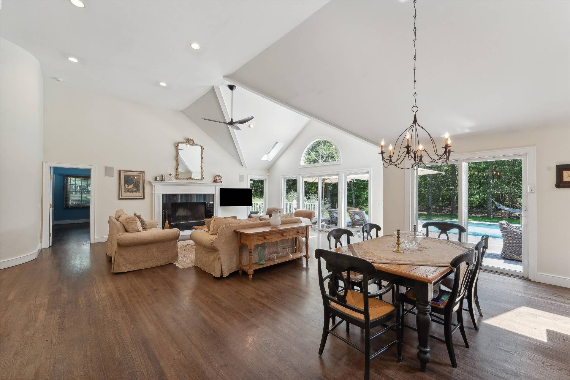18 Old Fields Lane Quogue, NY 11959 - Photo 11 of 34 a view of a dining room with furniture window and wooden floor