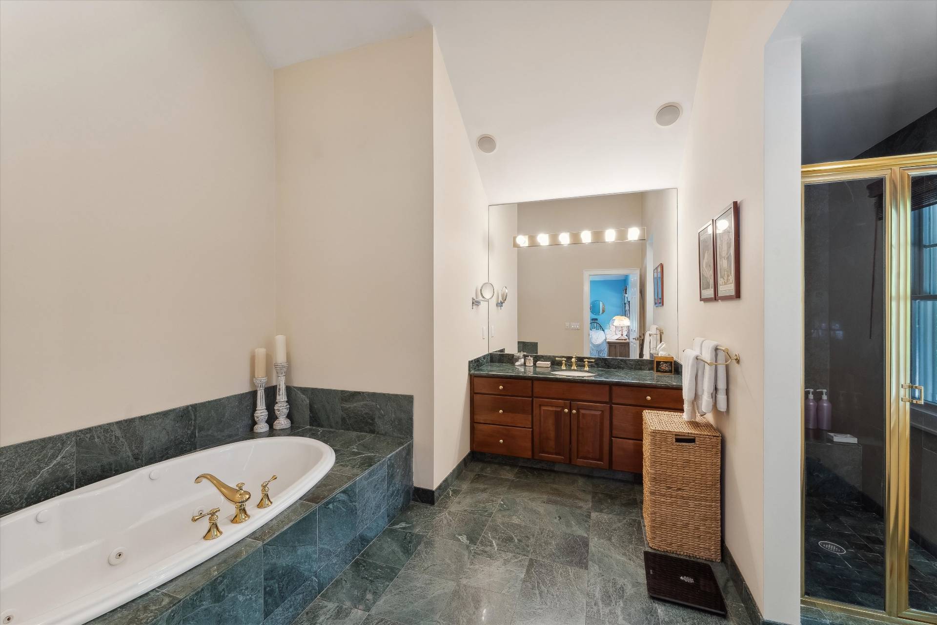 18 Old Fields Lane Quogue, NY 11959 - Photo 17 of 34 a spacious bathroom with a tub sink and mirror