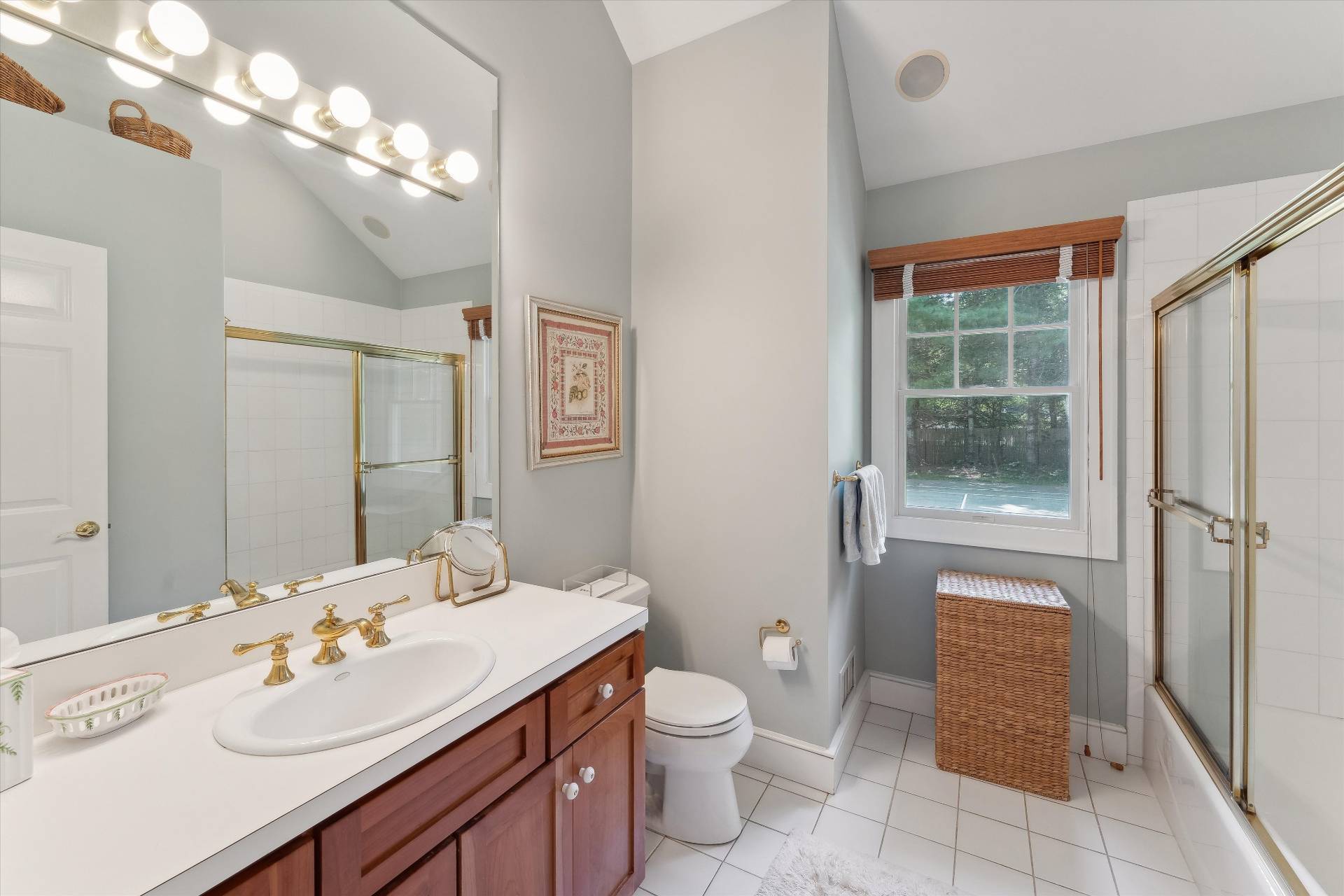 18 Old Fields Lane Quogue, NY 11959 - Photo 19 of 34 a bathroom with a sink a toilet and shower