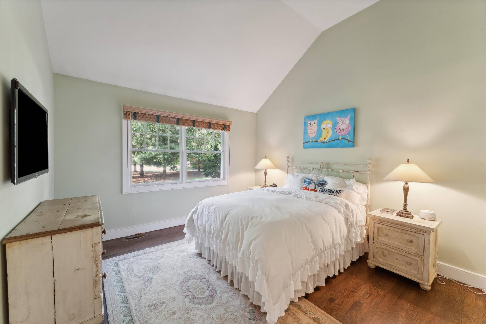 18 Old Fields Lane Quogue, NY 11959 - Photo 21 of 34 a bedroom with a bed and a flat screen tv