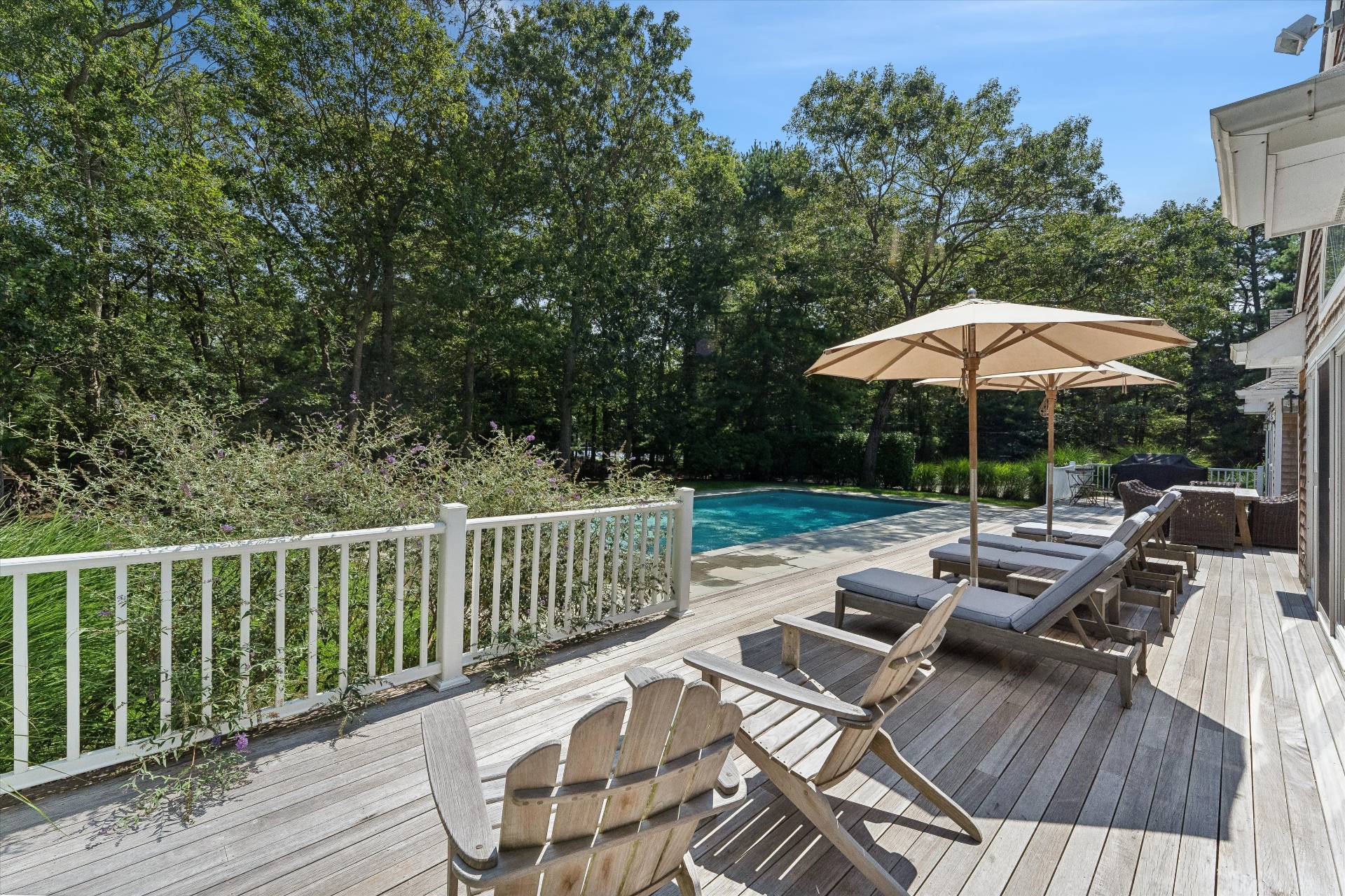 18 Old Fields Lane Quogue, NY 11959 - Photo 23 of 34 a view of balcony with wooden floor and outdoor seating