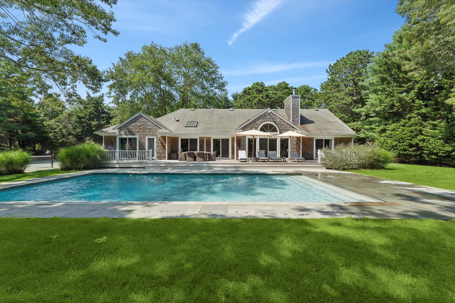 18 Old Fields Lane Quogue, NY 11959 - Photo 26 of 34 a front view of house with yard and green space