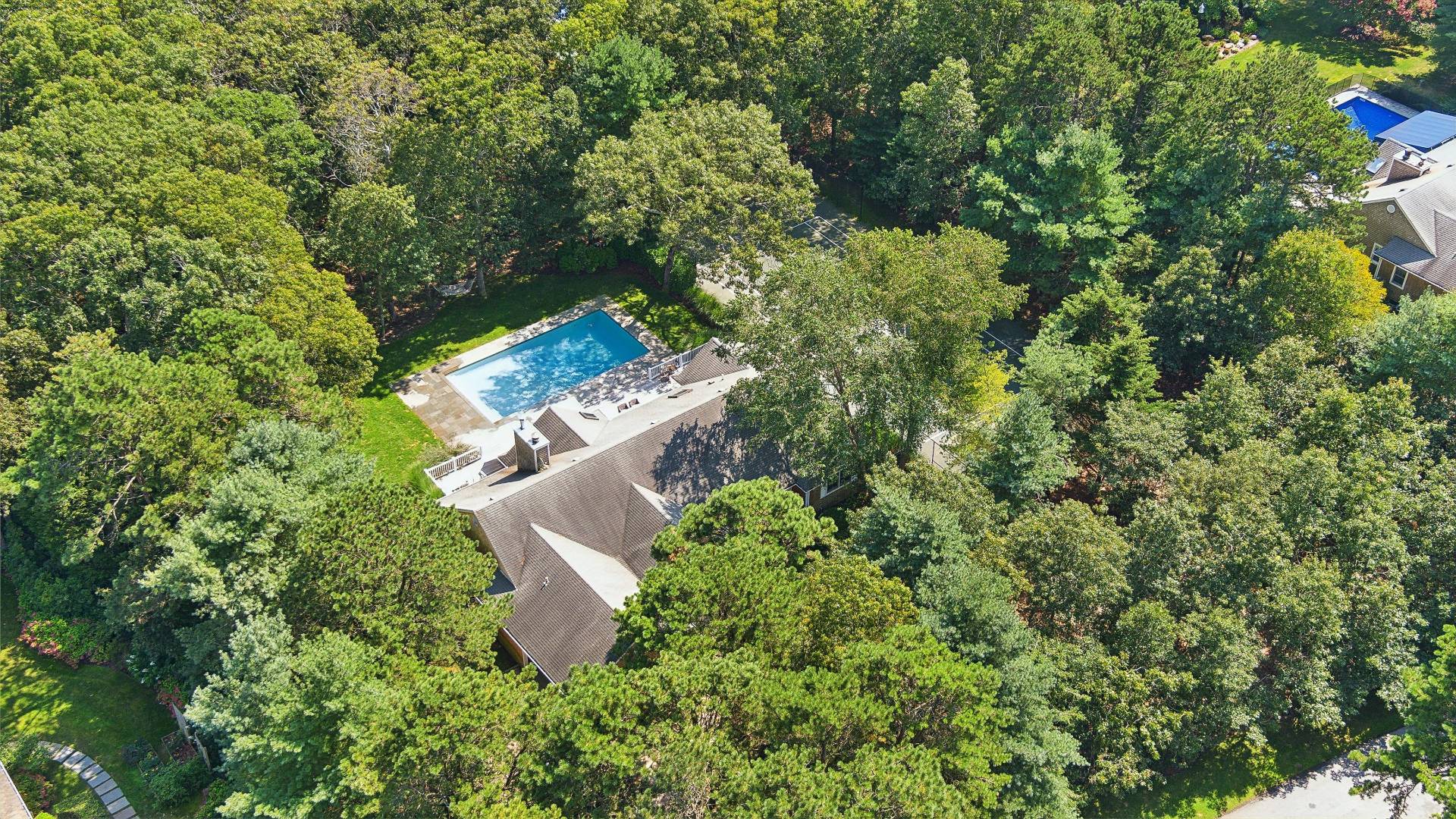 18 Old Fields Lane Quogue, NY 11959 - Photo 31 of 34 an aerial view of residential house with outdoor space and trees all around