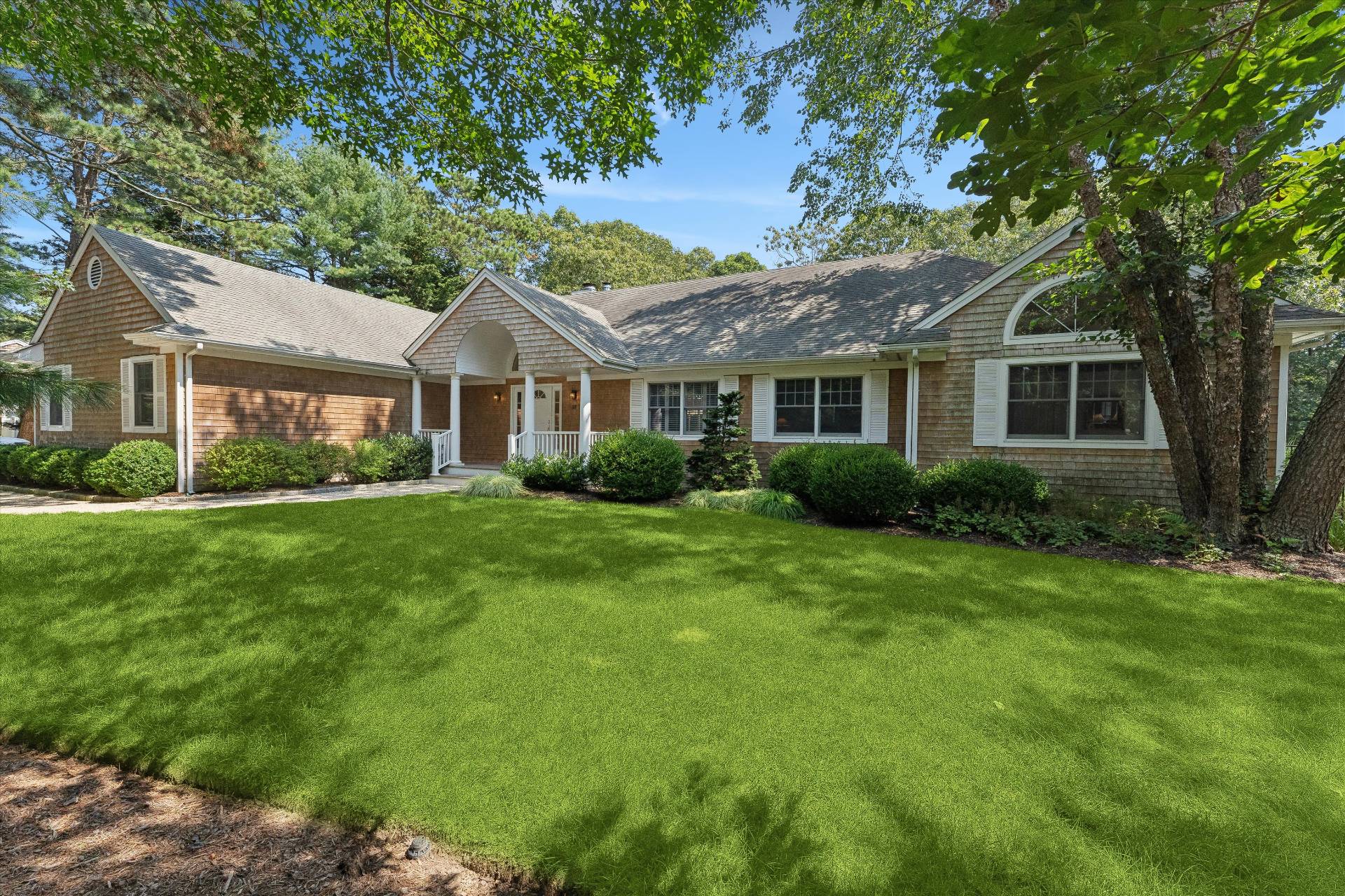 18 Old Fields Lane Quogue, NY 11959 - Photo 33 of 34 a front view of house with yard and green space