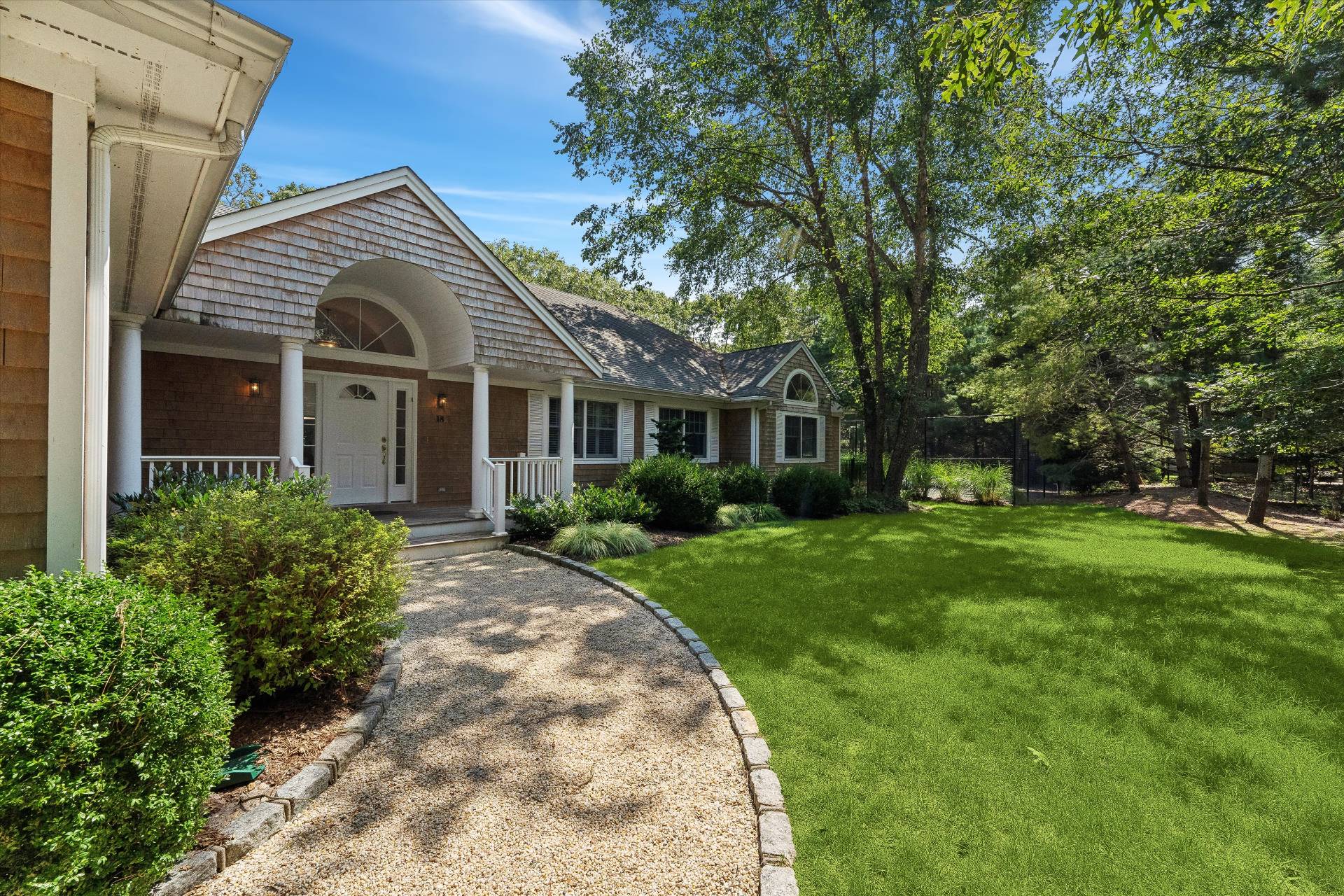 18 Old Fields Lane Quogue, NY 11959 - Photo 34 of 34 front view of a house with a yard