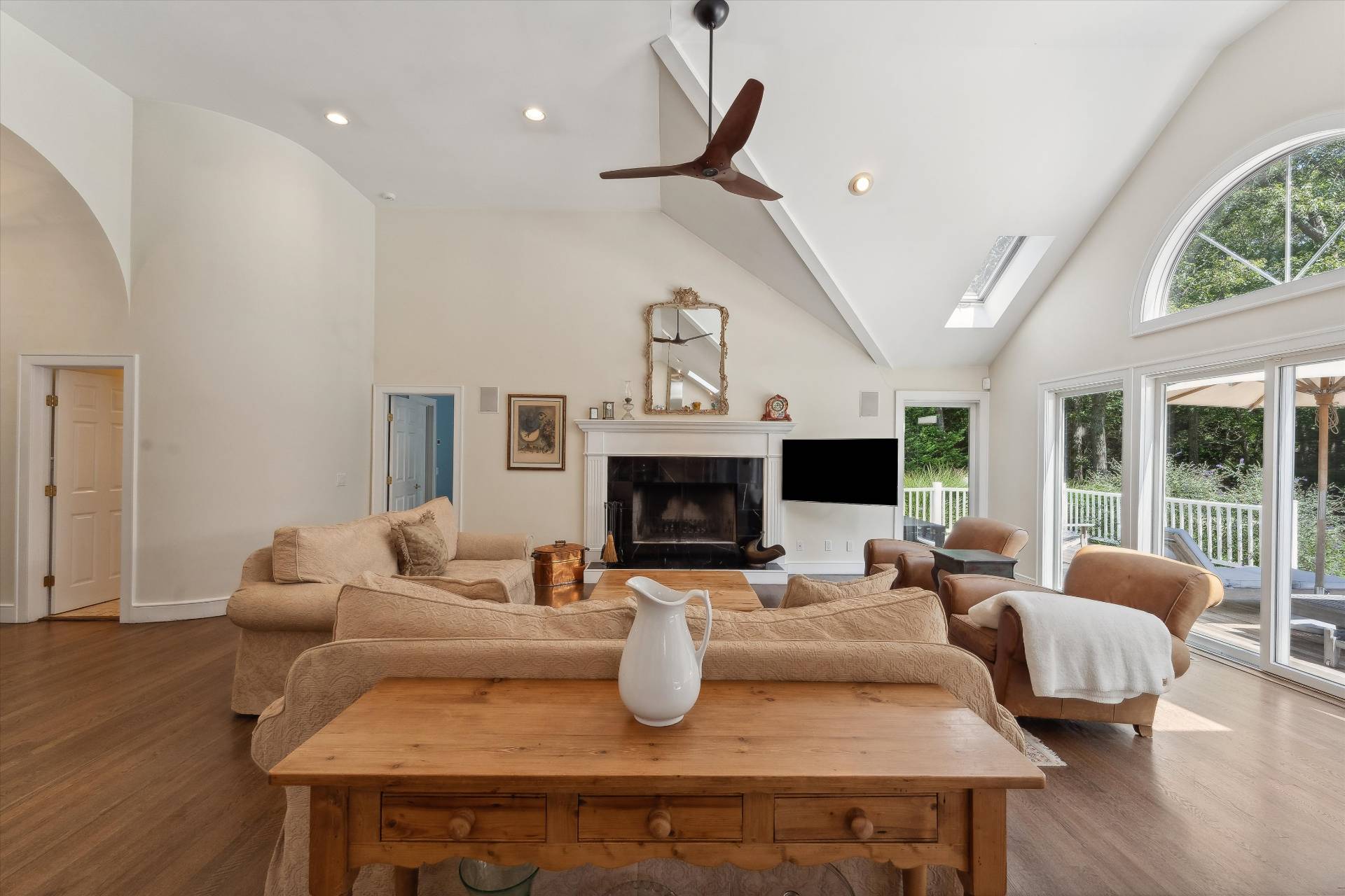 18 Old Fields Lane Quogue, NY 11959 - Photo 9 of 34 a living room with furniture fireplace and flat screen tv