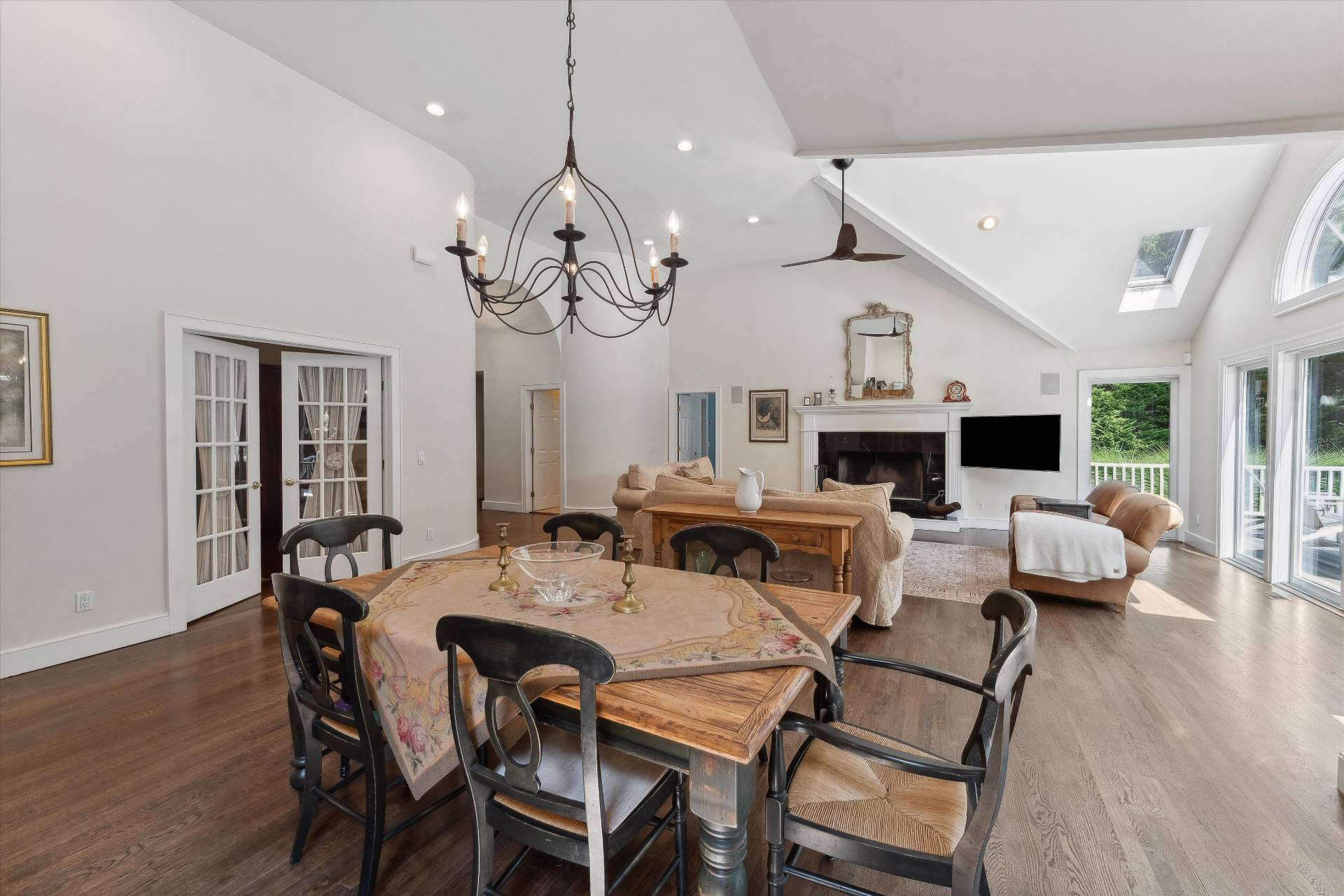 18 Old Fields Lane Quogue, NY 11959 - Photo 10 of 34 a view of a dining room with furniture wooden floor and chandelier