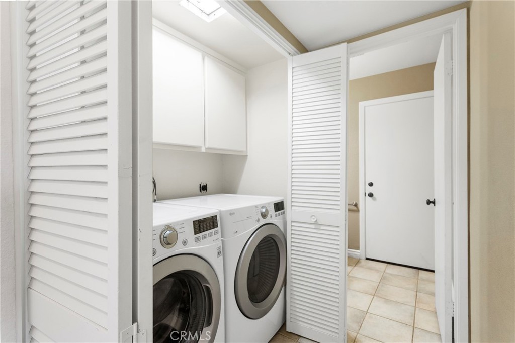 2881 Todd Street Oceanside, CA 92054 - Photo 15 of 41 a view of a hallway with washer and dryer