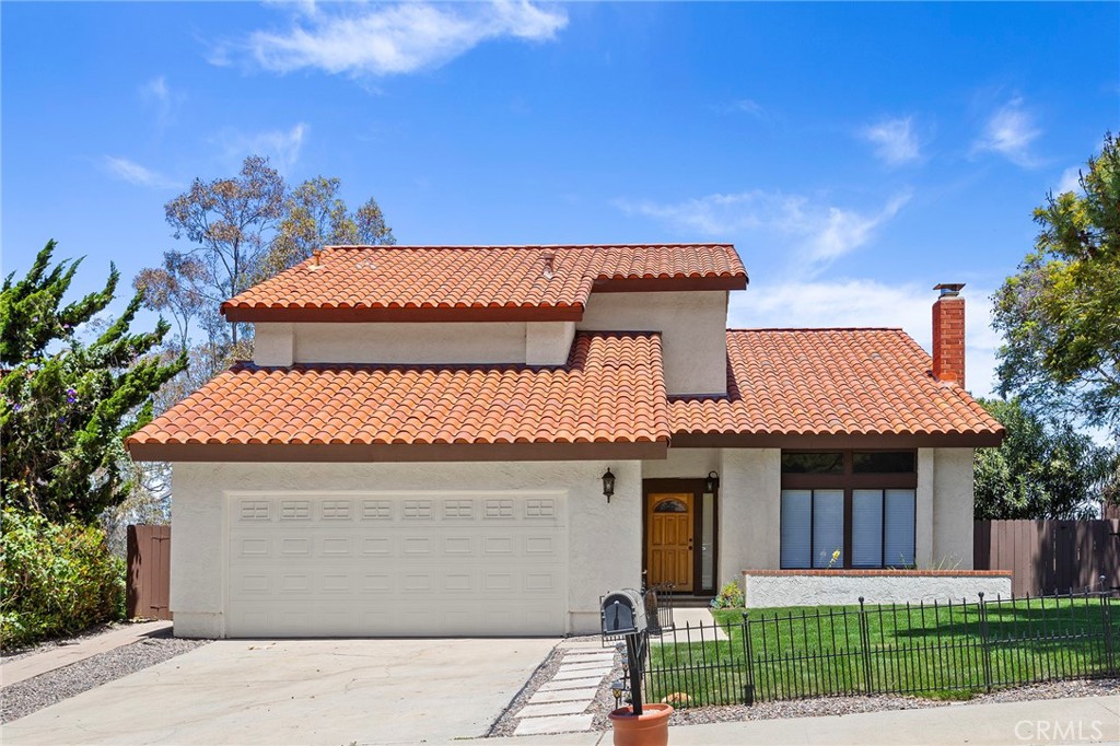2881 Todd Street Oceanside, CA 92054 - Photo 2 of 41 a front view of a house with a yard and potted plants