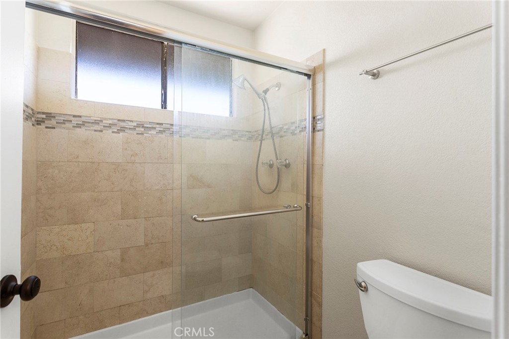 2881 Todd Street Oceanside, CA 92054 - Photo 22 of 41 a bathroom with a shower a toilet and a shower