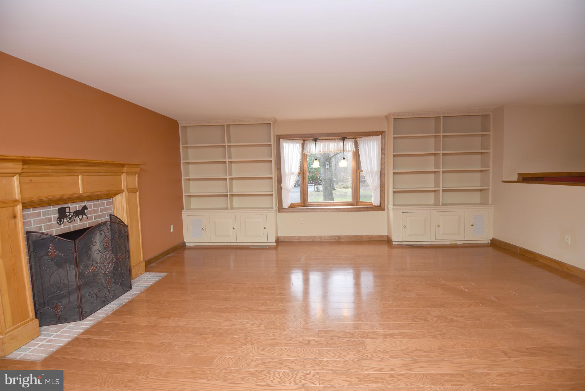 933 Woods Road Bear, DE 19701 - Photo 6 of 27 Large living room w/ bay window & fireplace