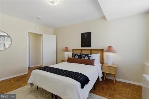 a bedroom with a bed and window