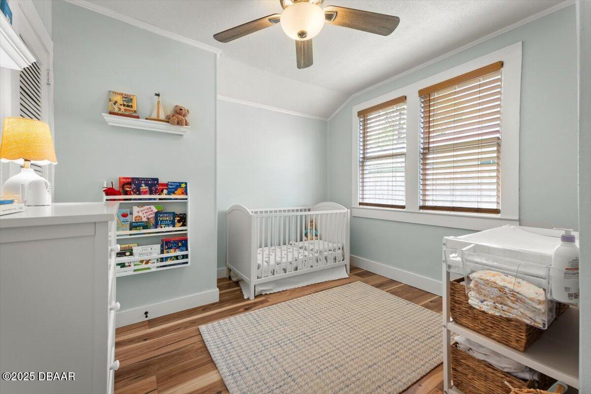2057 Huntsford Road Jacksonville, FL 32207 - Photo 14 of 30 a bedroom with a bed and a window