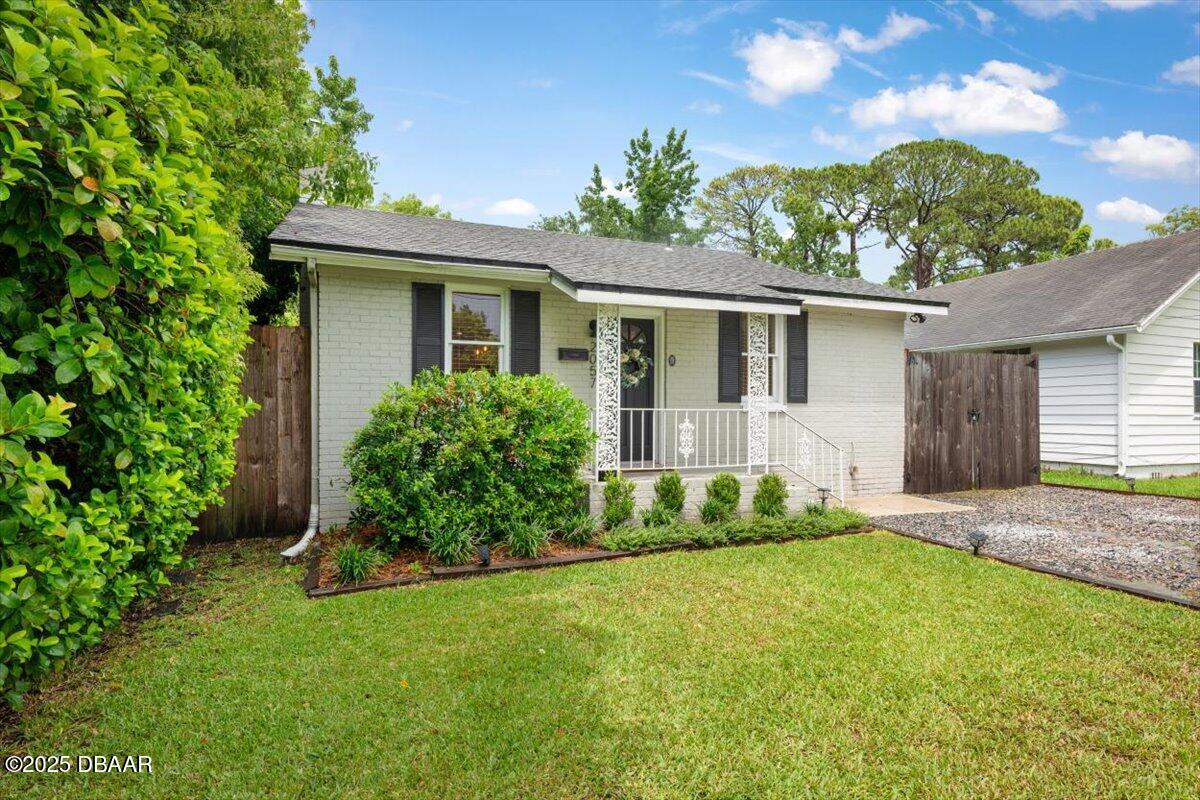 2057 Huntsford Road Jacksonville, FL 32207 - Photo 20 of 30 a front view of a house with a garden