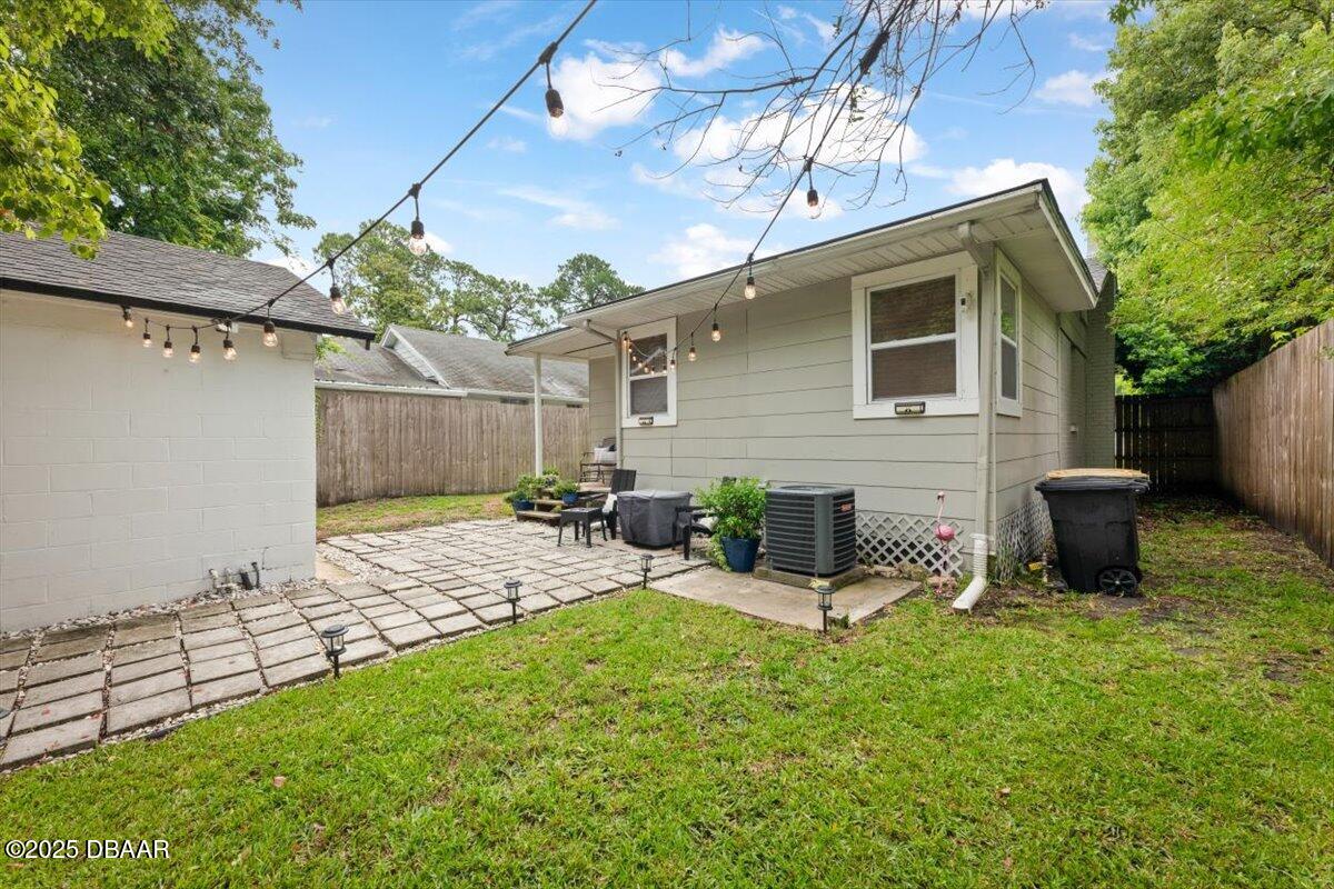 2057 Huntsford Road Jacksonville, FL 32207 - Photo 22 of 30 a view of a patio with table and chairs a barbeque with wooden fence