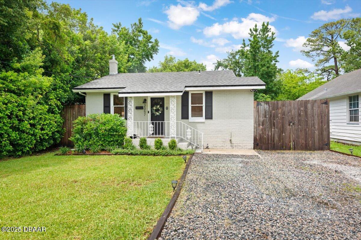 2057 Huntsford Road Jacksonville, FL 32207 - Photo 25 of 30 a front view of a house with a yard