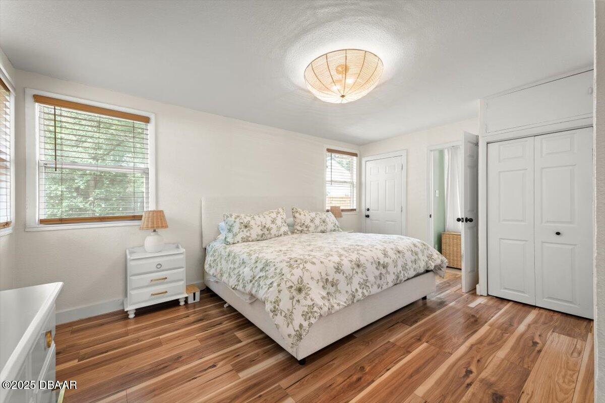 2057 Huntsford Road Jacksonville, FL 32207 - Photo 3 of 30 a bedroom with a bed and a chandelier