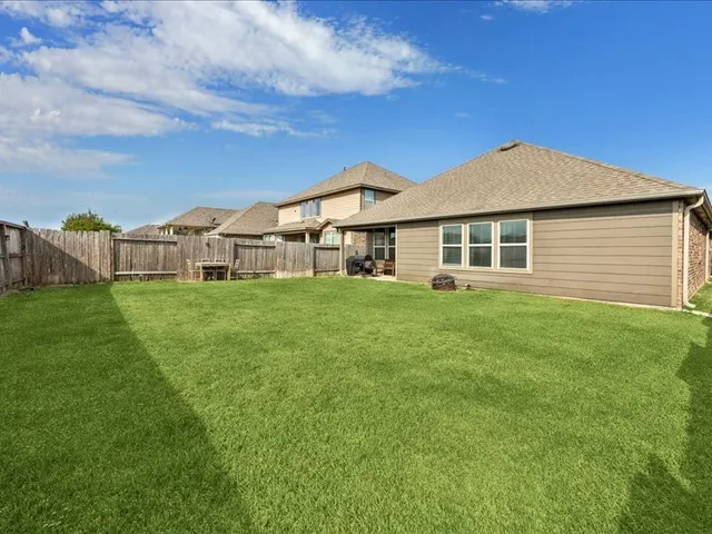 a view of a house with a big yard