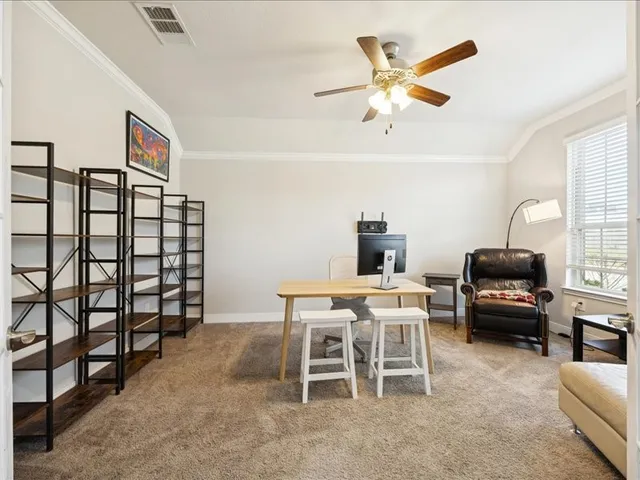 a living room with furniture a large window and a table