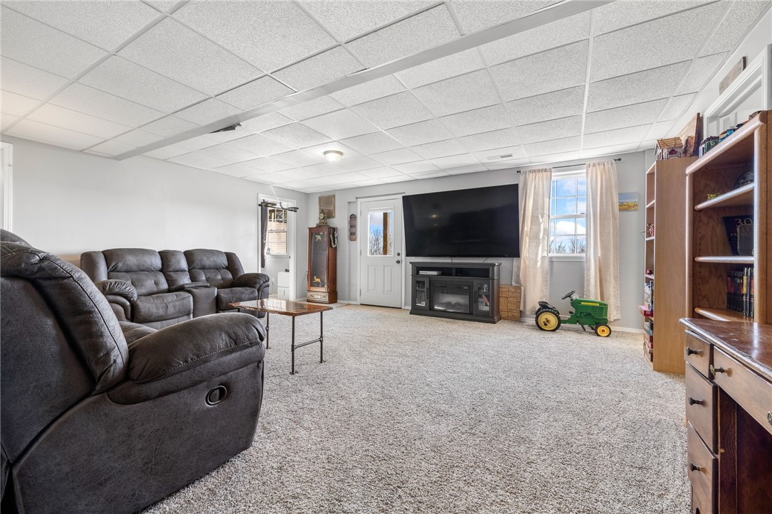 10974 Ricks Drive Harrison, AR 72601 - Photo 35 of 59 Living room featuring healthy amount of natural light, light colored carpet, and a paneled ceiling