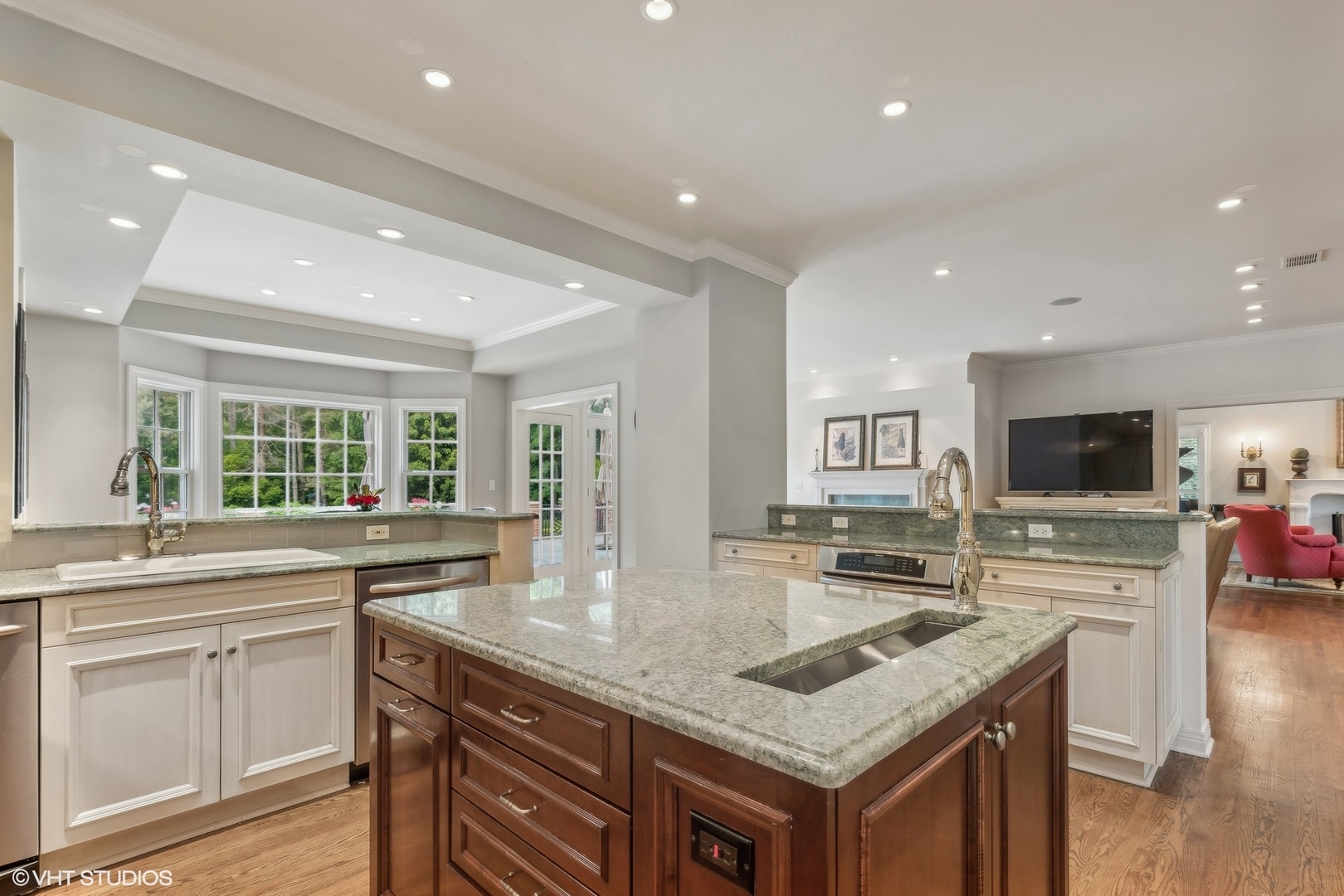 650 East Deerpath Road Lake Forest, IL 60045 - Photo 15 of 45 a kitchen with granite countertop a sink and a stove top oven with wooden floor