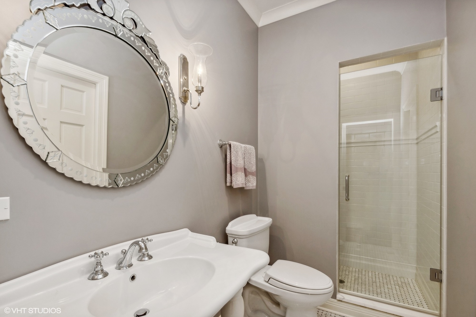 650 East Deerpath Road Lake Forest, IL 60045 - Photo 27 of 45 a bathroom with a sink a toilet and a mirror